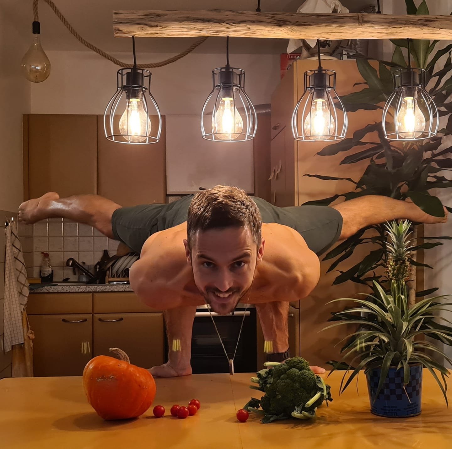 Sandro - Antaratma Yogashala Innsbruck Sandro doing Mayurasana in the kitchen