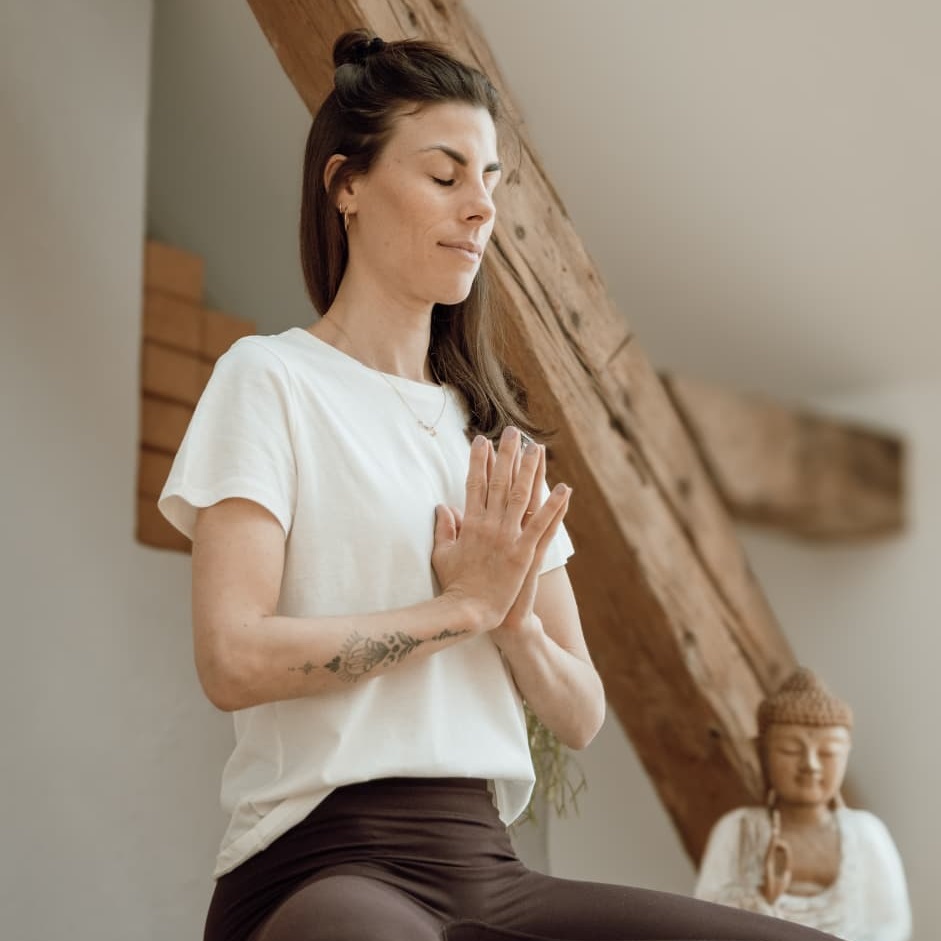 Lisa - Selfcare Sundays Lisa Blatzer sitting in sukhasana with namaste hands